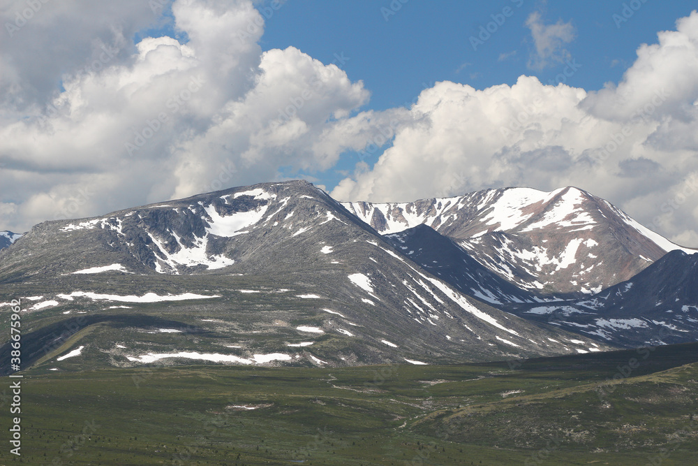 mountain landscape of taiga mountains and blue sky