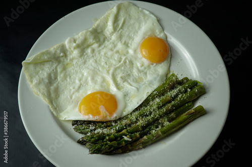 eggs with green asparagus and Parmisan photo