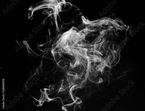 Fototapeta Naklejka Na Ścianę i Meble -  abstract fragment movement of white smoke on black background.