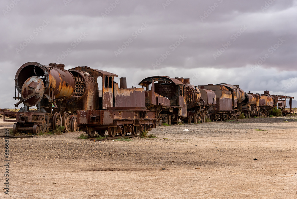 Old rusty locomotive abandoned in a train cemetery. Uyuni, Bolivia Old rusty locomotive abandoned in a train cemetery. Uyuni, Bolivia
