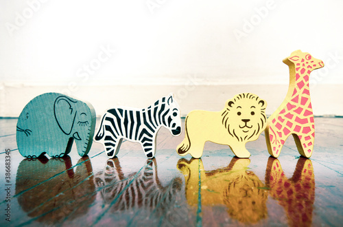 Canvas Print wooden safari animals on a wooden floor