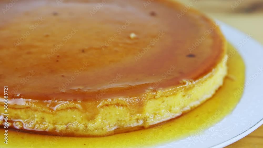 closeup panorama at whole round homemade soft milk flan with caramel syrup closeup panorama at whole round homemade soft milk flan with caramel syrup