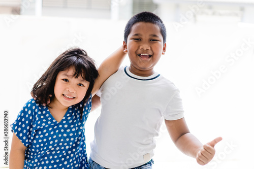 Equality and Racism.Asian kid girl and african american boy in school.Black lives matter no racism.Children with unity and friendship.Kids boy and girl.black lives matter for revolution protest.People