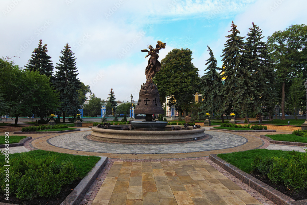 Kyiv, Ukraine-October 04, 2020:Wide angle landscape view of the new fountain in the Saint Volodymyr Hill. Saint Archangel Michael with sword and shield protects the city. Blue sky in the background