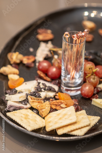 grape , dried fruit , cheese and cracker eat with wine