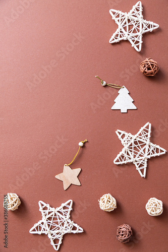 Christmas balls, toys, decorations flat lay on a brown background. New Year and Christmas composition