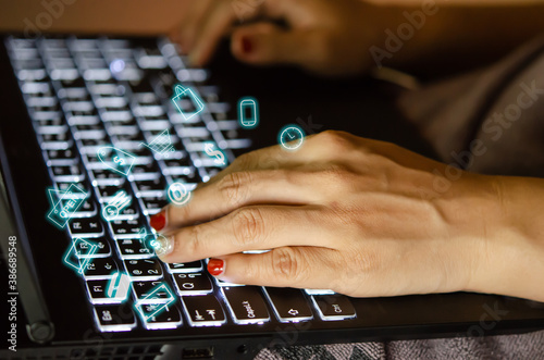 female hands using keyboard computer