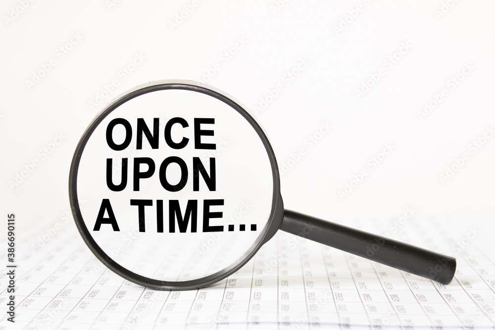 text ONCE UPON A TIME in a magnifying glass, office concept, business concept, Finance text ONCE UPON A TIME in a magnifying glass, office concept, business concept, Finance