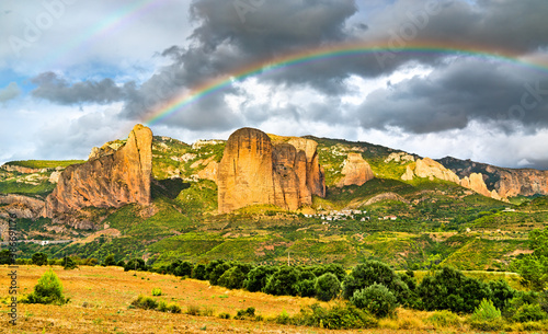Rainbow above the Mallos de Riglos, conglomerate rock formations in Huesca - Aragon, Spain