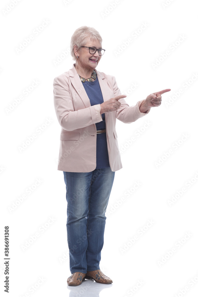 in full growth. attractive older woman pointing the direction in full growth. attractive older woman pointing the direction