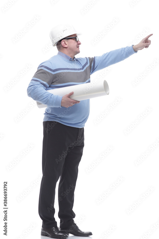 side view. a man with a roll of drawings looking somewhere ahead. side view. a man with a roll of drawings looking somewhere ahead.