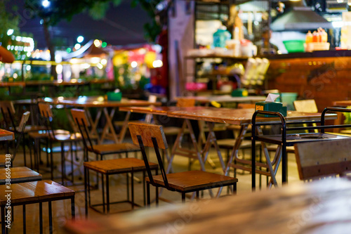 Soft focus background image of bar atmosphere and night light bokeh.