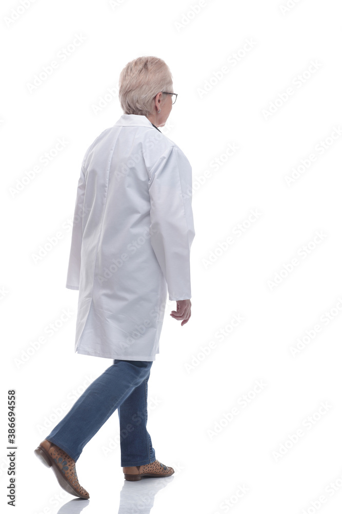 in full growth. experienced female doctor walking towards you in full growth. experienced female doctor walking towards you
