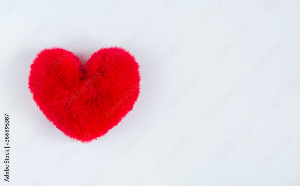 red soft heart on soft white background. A symbol of a healthy person. Valentine's Day gift red soft heart on soft white background. A symbol of a healthy person. Valentine's Day gift