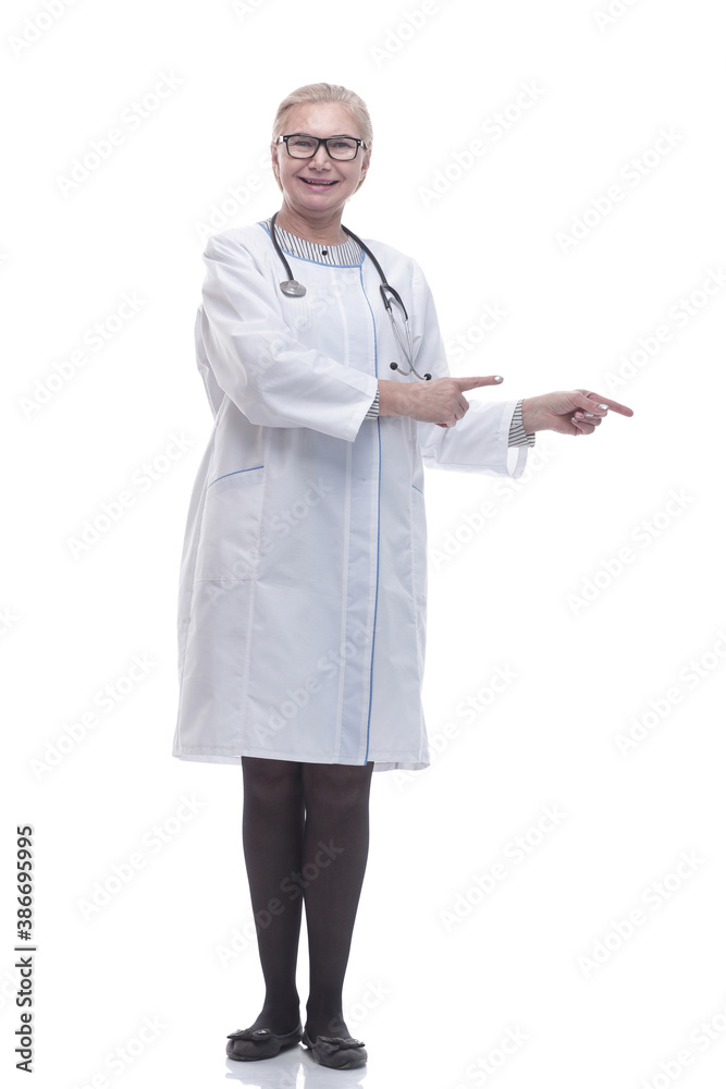 in full growth. smiling doctor pointing in the right direction in full growth. smiling doctor pointing in the right direction