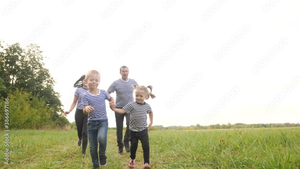 happy family children kid together run in the park at sunset silhouette. people in park concept mom dad daughter and son joyful run. happy family and little baby child summer kid dream concept fun happy family children kid together run in the park at sunset silhouette. people in park concept mom dad daughter and son joyful run. happy family and little baby child summer kid dream concept fun