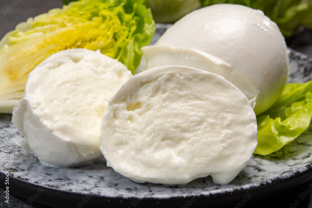 Сheese collection, balls on soft white mozzarella bufala cheese served with green cos lettuce Сheese collection, balls on soft white mozzarella bufala cheese served with green cos lettuce