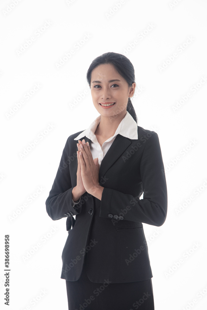 Asian young confident and successful business woman greeting and respectful with Thai culture on isolated white background Asian young confident and successful business woman greeting and respectful with Thai culture on isolated white background
