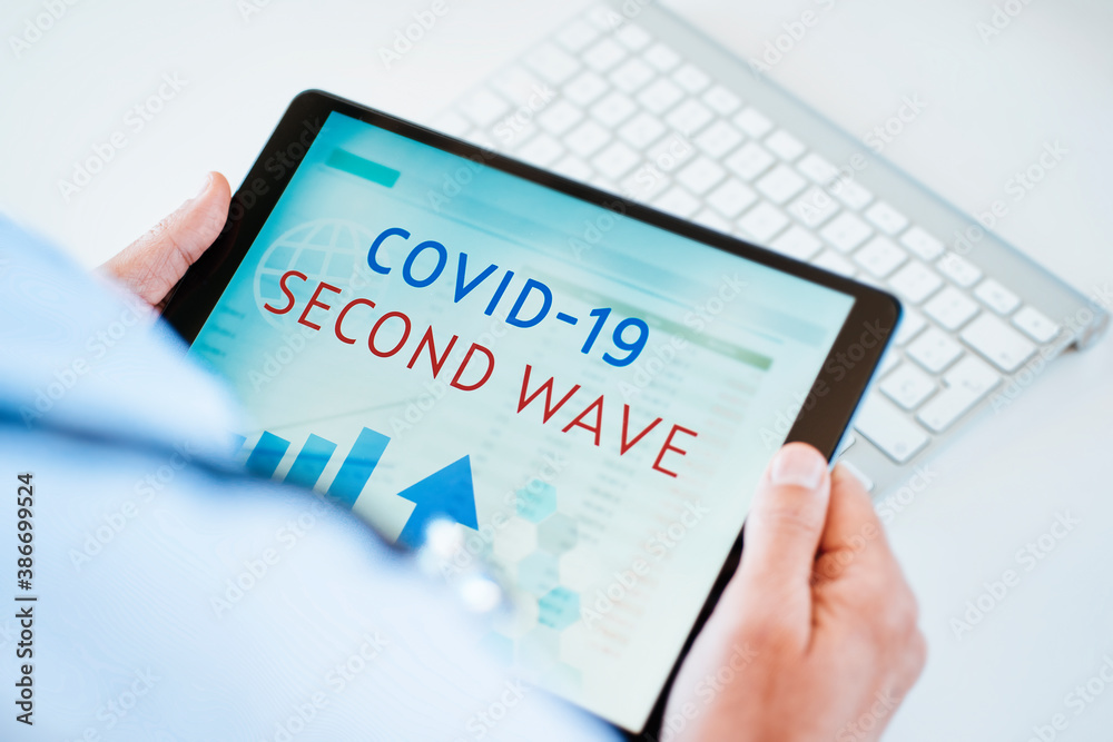 doctor and text covid-19 second wave in a tablet doctor and text covid-19 second wave in a tablet