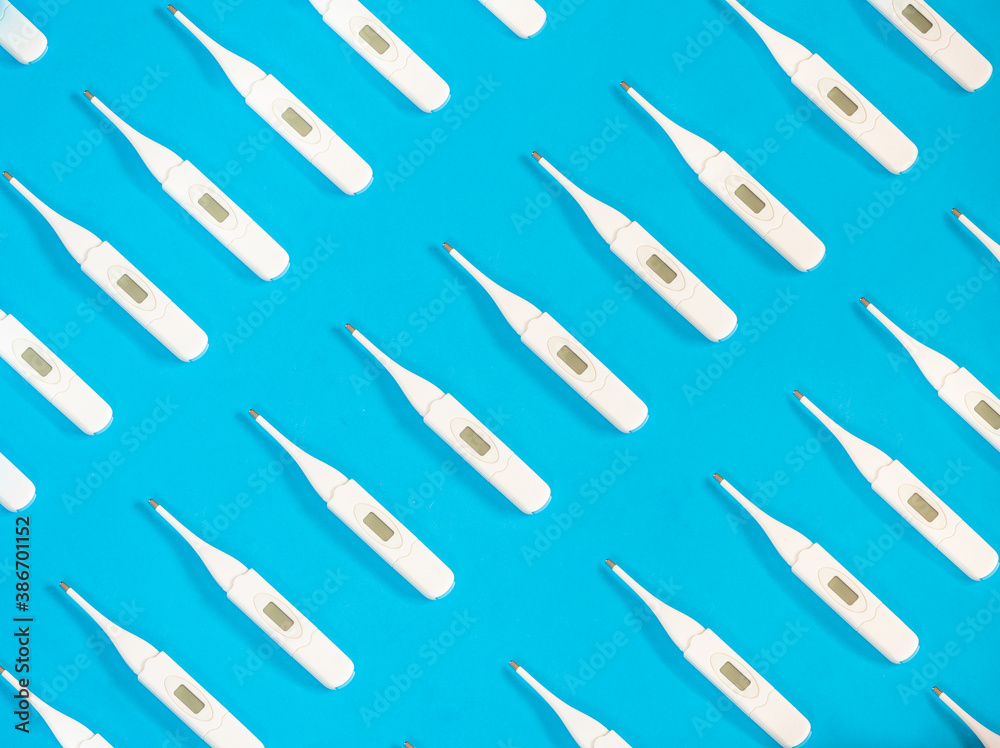 Fototapeta premium Digital thermometer pattern on blue background