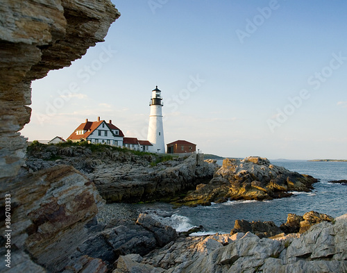 Lighthouse on the coast of Maine at sunset during summer