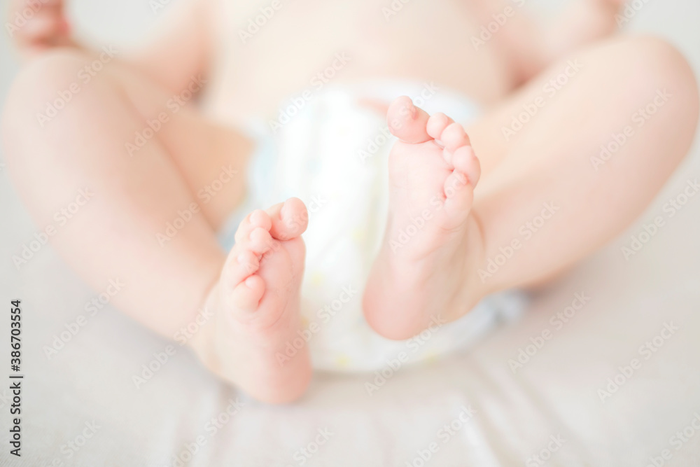 Small baby girl feet on the bed Small baby girl feet on the bed