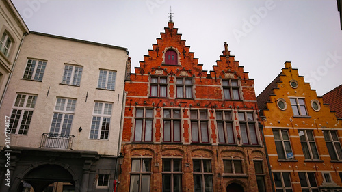 Bruges, Belgium - May 12, 2018: Roofs And Windows Of Old Authentic Brick Houses On Street Sint-Jakobsstraat