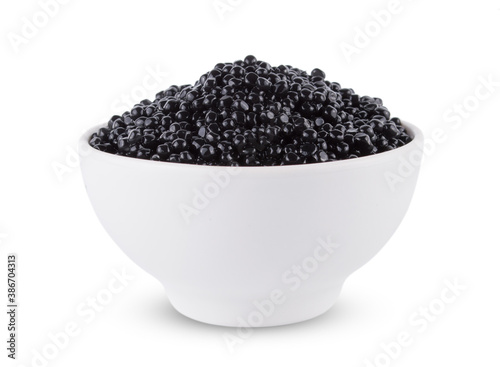 Bowl with delicious tasty black caviar on white background