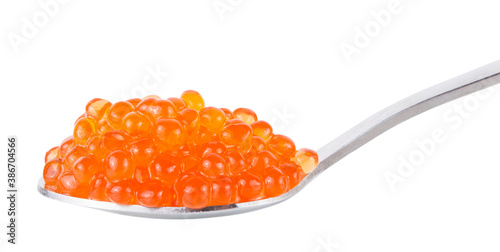 Red tasty salted caviar or fish eggs in spoon isolated on white background