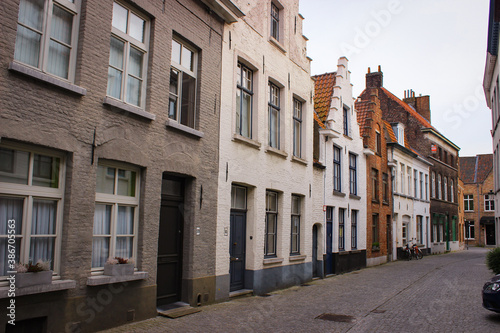Fototapeta Naklejka Na Ścianę i Meble -  Bruges, Belgium - May 12, 2018: Unique Street With Medieval Houses