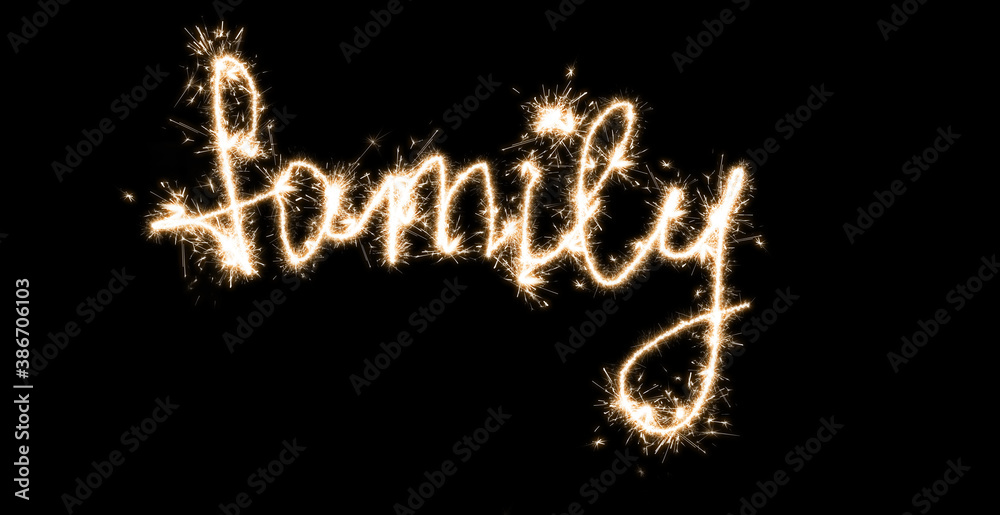 Inscription on a black background with sparklers Family Inscription on a black background with sparklers Family