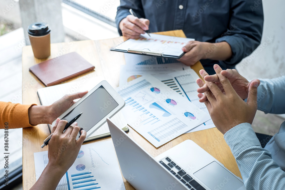 Business team collaboration discussing working analyzing with financial data and marketing growth report graph in team, presentation and brainstorming to strategy planning making profit of company