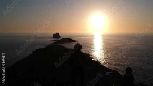 Sunset flying out shot of a man sillhuette on an island near El Toro , Mallorca island, photo