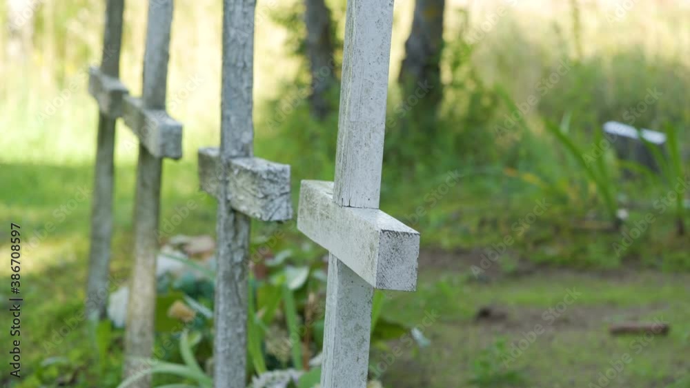 The wooden cross lined up in the cemetery park The wooden cross lined up in the cemetery park
