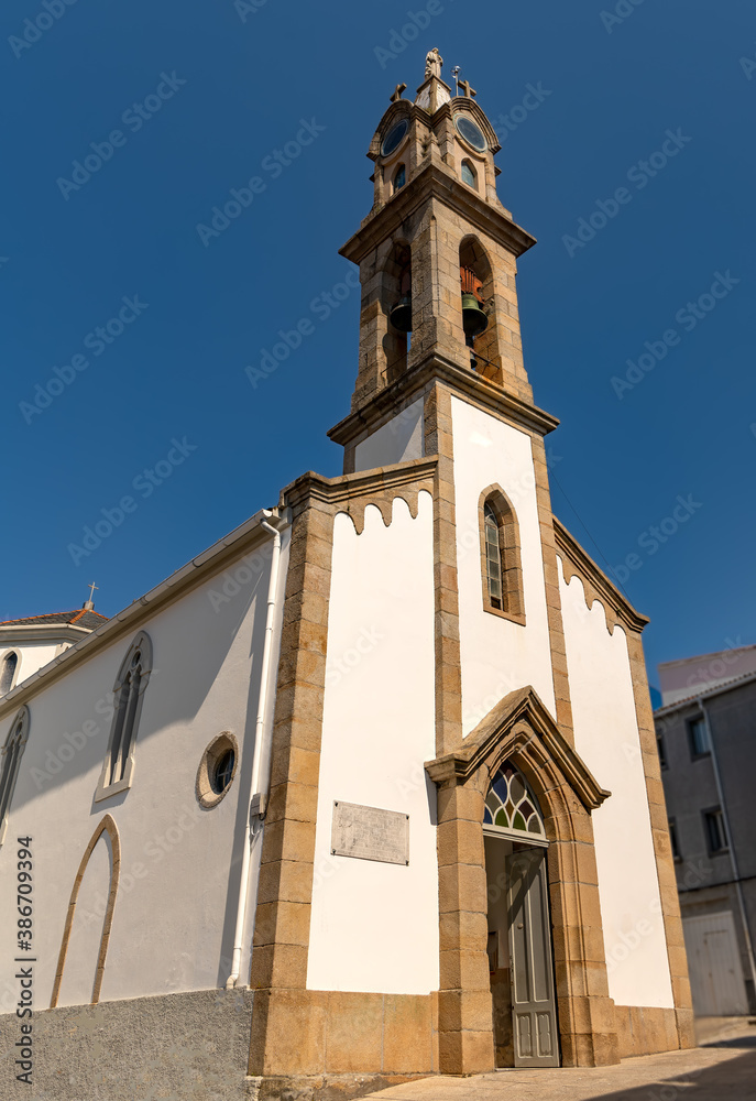 View of Saint Bartolomeu church in old town Cariño, in the Galicia region of Spain.