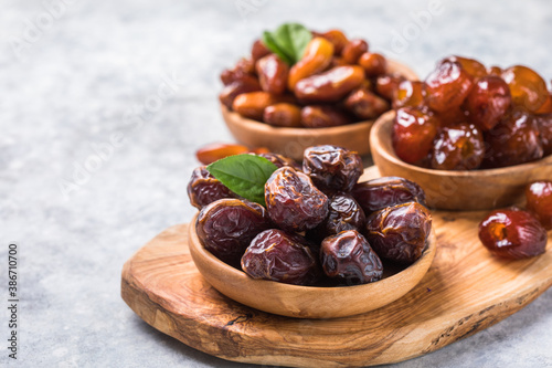 Dates or dattes palm fruit in wooden bowl is snack healthy. photo
