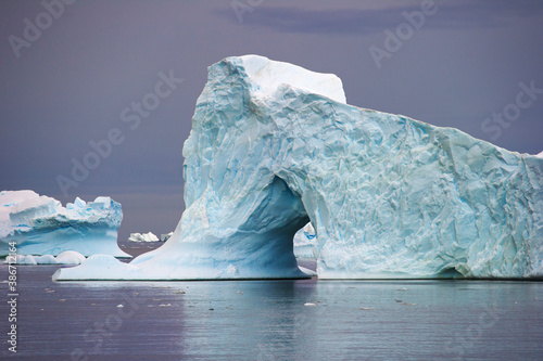 Iceberg with an arch in polar reagion