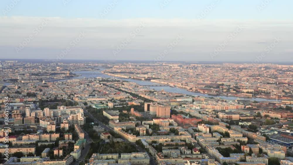 Aerial view of Neva river and historical center in Saint Petersburg, Russia. Large wide angle cityscape with cloudy sky, camera slowly moving forward Aerial view of Neva river and historical center in Saint Petersburg, Russia. Large wide angle cityscape with cloudy sky, camera slowly moving forward