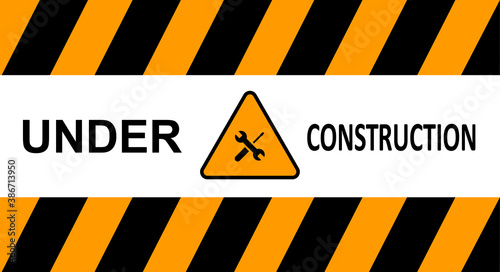 Under construction sign, construction tape. Black and yellow line striped. © SVIATOSLAV