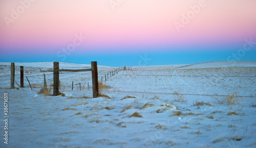 blue and pink sunset on the prairie