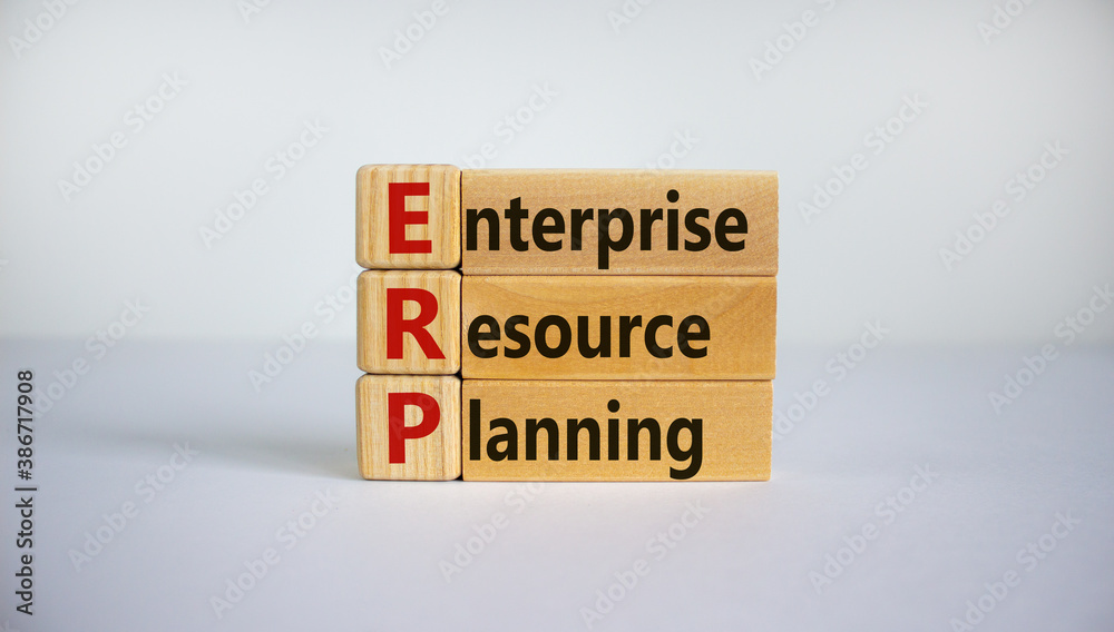 Naklejka premium Concept words 'ERP, enterprise resourse planning' on cubes on a beautiful white background. Business concept. Copy space.