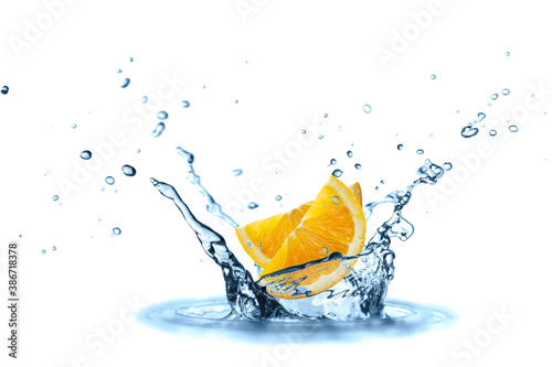Two orange slices falling in splashing water isolated on white © BarTa