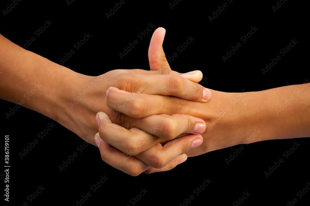 Shot of a human hand showing Linga mudra with interlocked fingers and