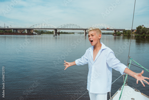 handsome Caucasian boy on the yacht  © k8most