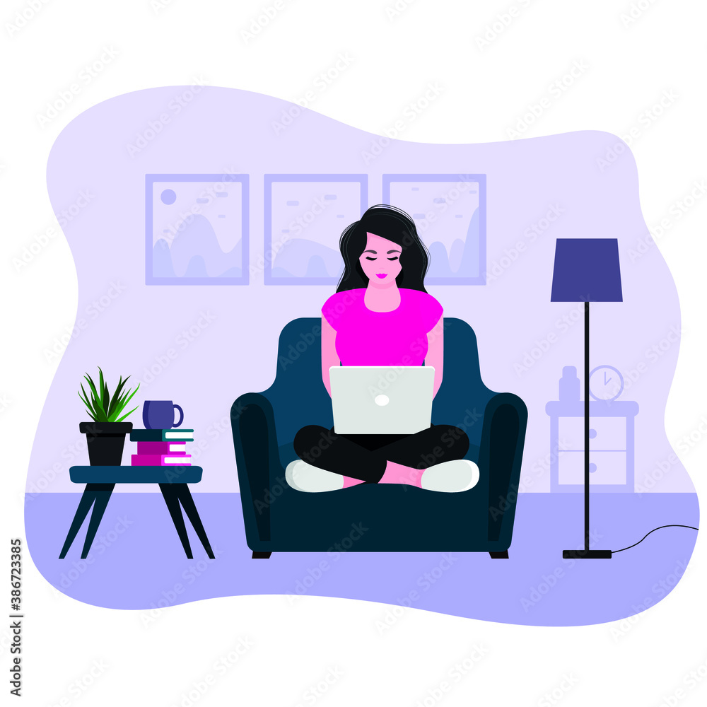 a young girl sits at home on an armchair, works at a laptop. Freelance concept