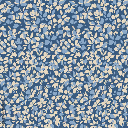 Simple botanical background. Nature ornament. Seamless pattern made of plain flower buds. Glade of small modest daisies. Trendy flat illustration. Fashion, textile and fabric application.