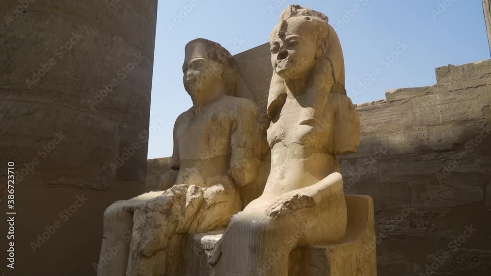 White Egyptian sculpture of Pharaoh and his wife in Luxor Temple, Egypt ...