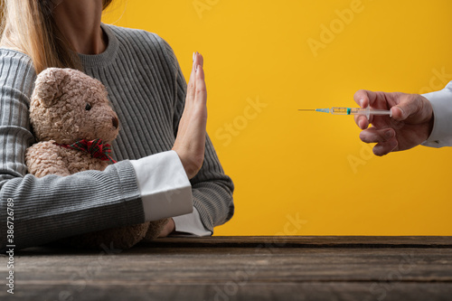 Photos Conceptual image of anti vaccine movement