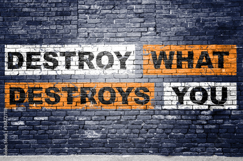 Destroy What Destroys You Motivation Quote Graffiti on Brick Wall photo