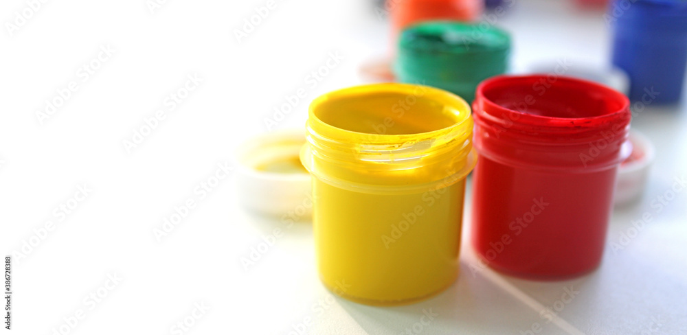 Children finger paint. Water based paints, isolated on a white background Children finger paint. Water based paints, isolated on a white background